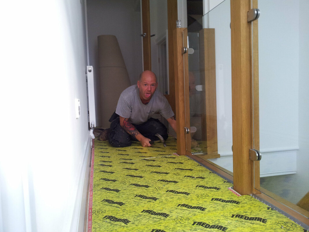 One of the fitters at Lancashire Carpets fitting in a full house refit in Accrington
